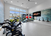 Thumbnail 14 of 25 - A gym with exercise equipment and a sign that says "Ovilla".