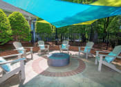 Thumbnail 25 of 36 - Outdoor Courtyard with Conversational Fire Pit & Picnic Area at Autumn Park Apartments, Charlotte, NC 28262