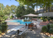 Thumbnail 9 of 31 - pool umbrella  at Park Summit Apartments in Decatur, GA 30033
