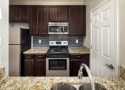 Thumbnail 1 of 31 - Kitchen Interior at Park Summit, Apartments Decatur, GA