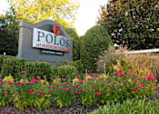 Thumbnail 31 of 31 - Entrance Signage with flowers at Polos at Hudson Corners Apartments, South Carolina 29650