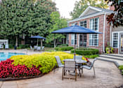 Thumbnail 14 of 31 - Tables and Chairs on Pool Deck at Polos at Hudson Corners Apartments, South Carolina 29650
