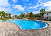 Thumbnail 19 of 29 - Outdoor Pool and Sundeck at Reserve Bartram Springs, Jacksonville, Florida