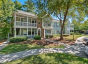 Thumbnail 1 of 33 - Building Exterior with Lush Landscaping  located at St. Andrews Apartments in Johns Creek, GA 30022