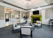 Thumbnail 20 of 33 - Modern clubhouse with fireplace  located at St. Andrews Apartments in Johns Creek, GA 30022