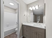 Thumbnail 15 of 25 - A bathroom with a white sink at Station Heights, Alpharetta Georgia 