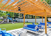 Thumbnail 22 of 25 - A wooden pergola with a ceiling fan at Station Heights, Georgia 