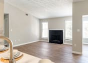 Thumbnail 5 of 25 - A modern living room with a fireplace at Station Heights, Alpharetta, GA