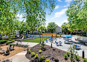 Thumbnail 19 of 25 - A playground with blue umbrella at Station Heights, Alpharetta 