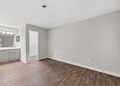 Thumbnail 14 of 25 - A room with a wooden floor at Station Heights, Georgia 