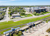 Thumbnail 25 of 28 - an aerial view of a city with buildings at Station at Old Town, Lewisville