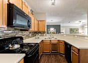 Thumbnail 10 of 34 - Well Equipped Eat-In Kitchen at Sugarloaf Crossing Apartments, Lawrenceville, Georgia