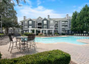 Thumbnail 18 of 39 - Pool and building  at The Berkeley Apartments, Georgia, 30096
