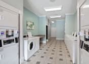 Thumbnail 35 of 39 - laundry center washing machine  at The Berkeley Apartments, Georgia, 30096