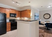 Thumbnail 2 of 39 - Model kitchen counter  at The Berkeley Apartments, Georgia, 30096