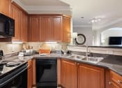 Thumbnail 1 of 39 - Model Kitchen at The Berkeley Apartments, Georgia, 30096