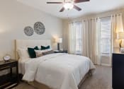 Thumbnail 11 of 39 - Master bedroom with bed at The Berkeley Apartments, Georgia, 30096