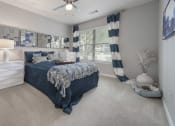 Thumbnail 11 of 33 - model bedroom with ceiling fan and furniture at The Haven, Atlanta Georgia