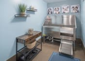 Thumbnail 24 of 33 - a kitchen with a stainless steel stove and a table at The Haven, Atlanta, GA