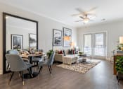 Thumbnail 2 of 15 - A modern dining room with a large table and chairs.at The One at Millington, Millington, TN 38053