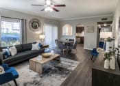 Thumbnail 5 of 33 - Spacious Living Room with Ceiling Fan and LVT Flooring  located at Retreat at Steeplechase in Houston, TX 77065