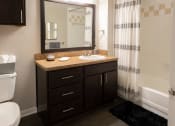 Thumbnail 11 of 33 - Modern Bathroom with Framed Mirror  located at Retreat at Steeplechase in Houston, TX 77065