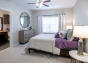 Thumbnail 7 of 33 - Main Bedroom with Ceiling Fan and Large Windows  located at Retreat at Steeplechase in Houston, TX 77065