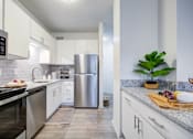 Thumbnail 3 of 23 - Kitchen Cabinetry at The Waters at Chenal Apartments, Arkansas, 72211