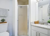 Thumbnail 10 of 23 - Bathroom with mirror at The Waters at Chenal Apartments, Little Rock, AR