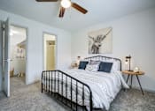 Thumbnail 8 of 23 - Bedroom with large bed at The Waters at Chenal Apartments, Little Rock, AR, 72211