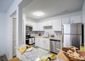 Thumbnail 4 of 23 - Kitchen with Modern Appliances at The Waters at Chenal Apartments, Little Rock, 72211
