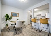 Thumbnail 5 of 23 - Kitchen and Dining Table at The Waters at Chenal Apartments, Little Rock, AR