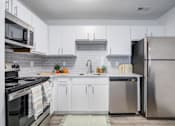 Thumbnail 1 of 23 - Kitchen with Refrigerator at The Waters at Chenal Apartments, Little Rock, Arkansas