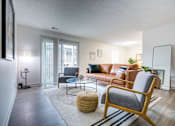 Thumbnail 7 of 23 - Living Room with Chair at The Waters at Chenal Apartments, Little Rock