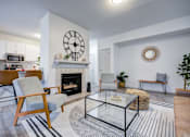 Thumbnail 6 of 23 - Living Room with Fireplace at The Waters at Chenal Apartments, Little Rock, AR