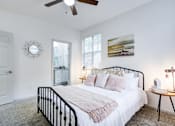 Thumbnail 12 of 23 - Bedroom with bed at The Waters at Chenal Apartments, Little Rock