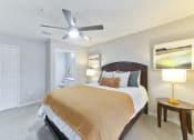 Thumbnail 8 of 27 - a bedroom with a large bed and a ceiling fan at Twenty35 at Timothy Woods, Athens, 30606