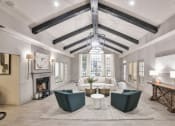 Thumbnail 12 of 27 - a living room with a fireplace and a ceiling with beams at Twenty35 at Timothy Woods, Athens, Georgia