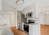 Thumbnail 2 of 33 - Empty Kitchen at Villas on Briarcliff, Atlanta