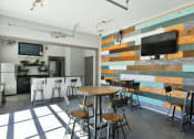 Thumbnail 15 of 20 - Clubhouse with Bar Stools and TV located at Walden Oaks, South Carolina