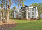 Thumbnail 15 of 15 - Residential building exterior with screened porches at Westbury Mews Apartments in Summerville SC 29485