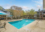 Thumbnail 7 of 15 - Swimming pool and sundeck at Westbury Mews Apartments in Summerville SC 29485