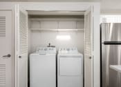 Thumbnail 14 of 34 - In-unit washer and dryer inside a closet with shelf storage