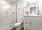 Thumbnail 12 of 34 - Bathroom with a stand-in shower and white cabinetry