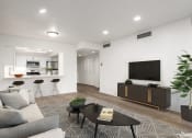 Thumbnail 7 of 34 - Living room with a view of the kitchen and hardwood flooring