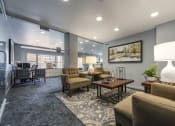 Thumbnail 15 of 16 - Office area with seating and a view of the leasing office desks