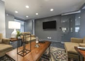 Thumbnail 16 of 16 - Office area with carpet flooring, seating, and a TV