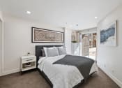Thumbnail 7 of 16 - Bedroom with queen size bed, patio entrance