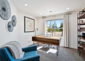 Thumbnail 6 of 16 - Decorated office area or bedroom space with large windows