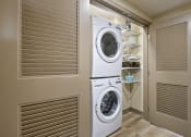 Thumbnail 12 of 25 - a washer and dryer in a laundry room